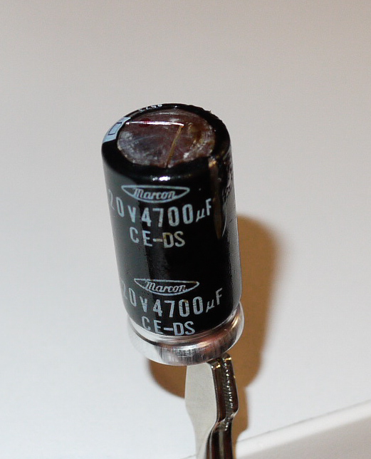 Swollen capacitor, leaking capacitor